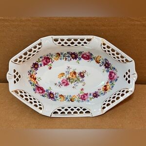 This is an Antique, oval, reticulated, floral bowl by Schwarzenhammer Bavaria.